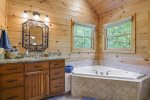 Upstairs master bathroom with a jetted tub